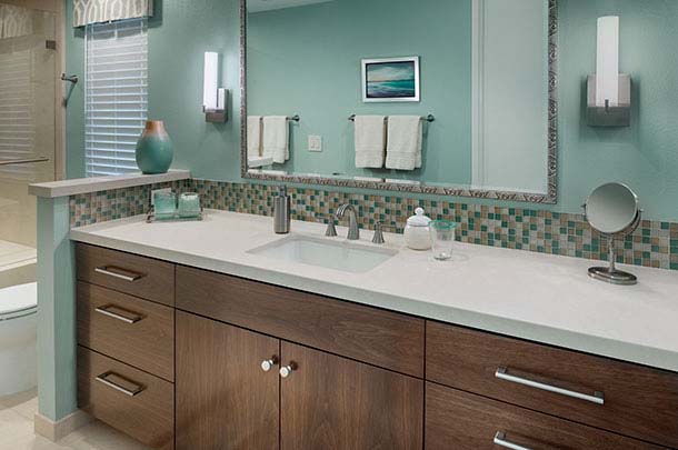 Large bathroom sink countertop, dark cabinets, sconces - large image