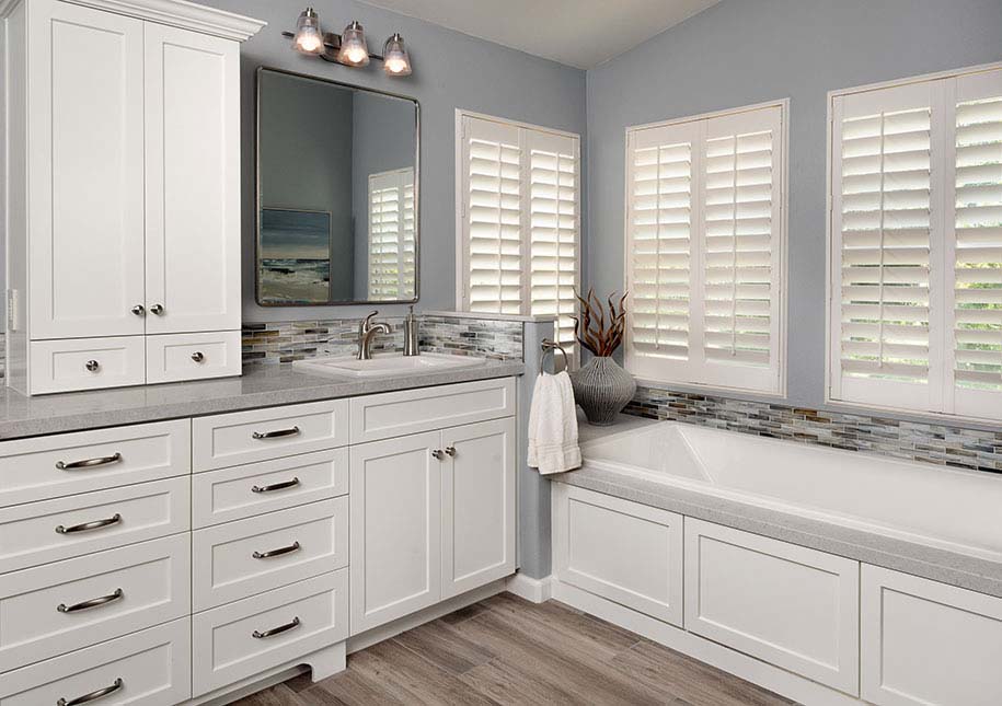 White cabinetry, bath and large mirror - x-large photo