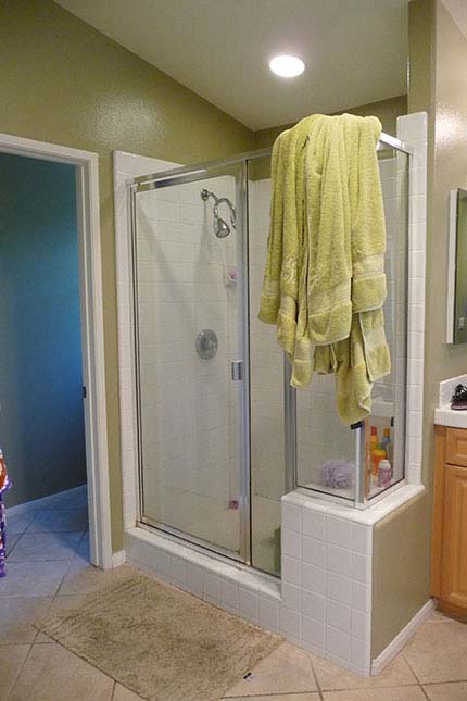 BEFORE: shower stall with out-dated tile and glass door - x-large photo