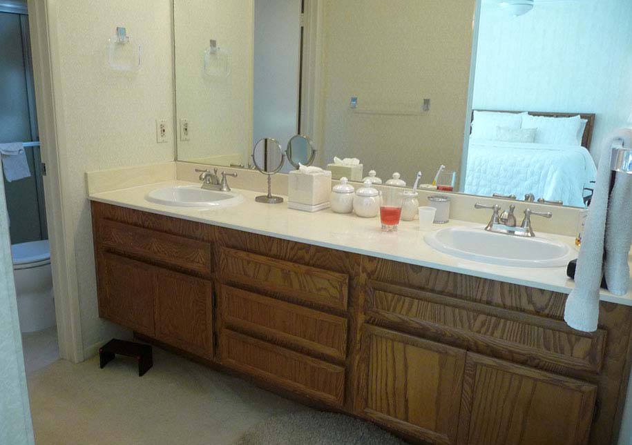 BEFORE: large wall mirror, two sinks in bathroom - x-large photo